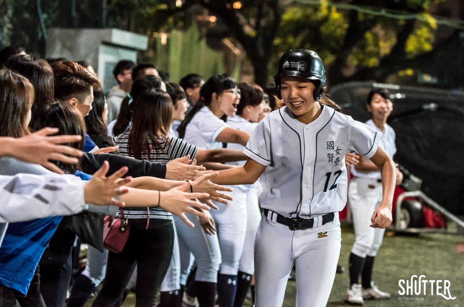 Photo of Phoebe playing softball